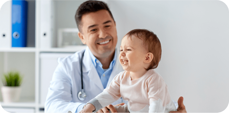 Doctor with a child who is his patient.